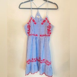 Blue and white striped dress with red details